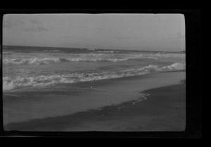 Primary view of object titled '[A beach with the tide rolling in]'.