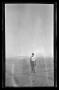 Primary view of [Byrd Williams Jr. standing in the desert]