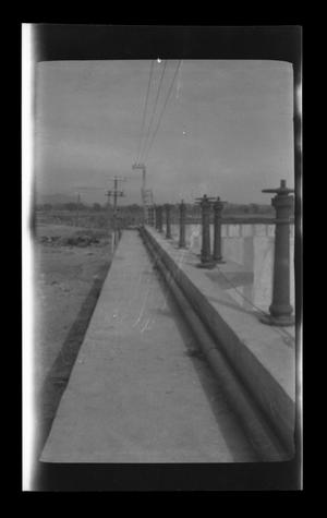 Primary view of object titled '[Power lines over a bridge]'.