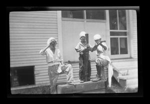 Primary view of object titled '[John, Charles, and Byrd Williams, III playing pirates]'.