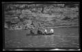 Photograph: [Two couples in a boat on a river]