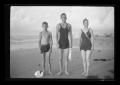 Photograph: [Irene Williams on the beach with her son Charles and a man]
