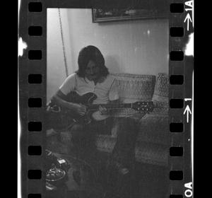 Primary view of object titled '[Danny Cole playing guitar]'.