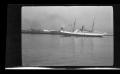 Primary view of [A cargo ship in a harbor]