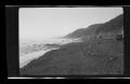 Photograph: [Model T's driving along a shoreline]