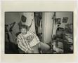 Photograph: [Photograph of man seated in apartment]