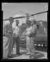 Photograph: [Crew of YH-40 stopping over at Hurst heliport]