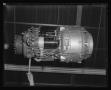 Primary view of [The Lycoming turbine engine being hoisted to the top of XH-40 #1]