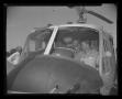 Photograph: [Officers sitting inside the H-40 at Hurst Heliport]