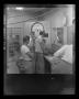 Photograph: [Bell employees standing in a control room]
