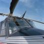 Photograph: [Nose, cockpit, and blade of the Bell 412SP]