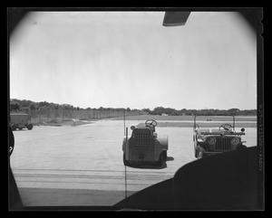 Primary view of object titled '[Two vehicles on Hurst Heliport]'.