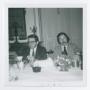 Photograph: [Two Men Sitting at Table]