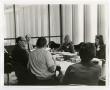 Photograph: [A Group Discussion and Reviewing of Documents]