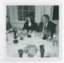 Photograph: [Three Persons Sitting and Conversing]