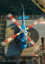Primary view of [A blue helicopter on a helipad]