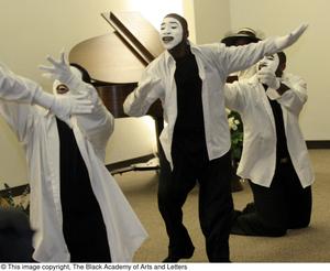 Primary view of [Three costumed performers acting out a scene]