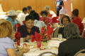 Photograph: [Guests enjoying meal during luncheon]