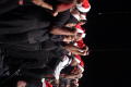 Photograph: [Choir members performing on stage]
