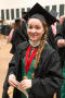 Primary view of [Graduate student poses in cap and gown]