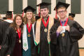 Photograph: [Students Smile for Photo at the Fall 2014 Undergraduate Commencement…