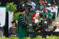 Photograph: [UNT President Neal J. Smatresk shakes hands with Graduating Student]