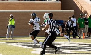 Primary view of object titled '[UNT Defensive Back to Tackle Portland player]'.