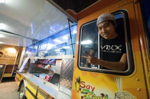 Primary view of object titled '[Say Kimchi food truck employee]'.