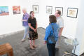 Photograph: [People walking around the Diane E. Williams art reception]