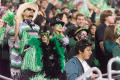 Photograph: [Fans Dressed in Green During the Homecoming Game]
