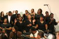 Photograph: [Choir members performing together]