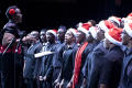 Photograph: [Choir sings as their director conducts them]