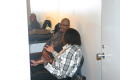 Primary view of [Curtis King and man speaking in dressing room]