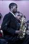 Photograph: [Saxophone players playing their instruments]