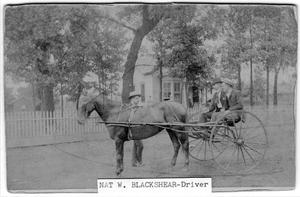 [Nathanial W. Blackshear at reins of a wagon]