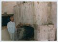 Photograph: [Person Standing by Fireplace in Treviño-Uribe Rancho]