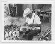 Photograph: [Man Weaving a Sheath]