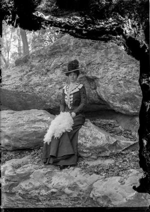 [Outdoor Portrait of Woman on Rock Ledge]