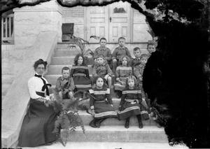 Primary view of object titled '[Group Portrait of Schoolchildren and Teacher on Steps]'.
