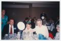 Photograph: [Three People at a Banquet Table]