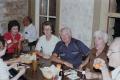 Photograph: [Group Around Dinner Table #2]