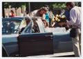 Thumbnail image of item number 1 in: '[Actors and film crew prepare for motorcade scene in "JFK"]'.