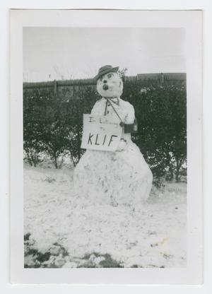 Primary view of object titled '[Snowman listens to KLIF radio]'.