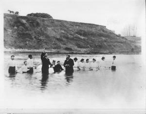 Primary view of object titled '[Baptism taking place in a river, possibly the Brazos]'.