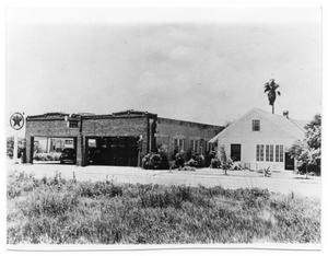 Primary view of object titled '[View of Texaco Station and House]'.