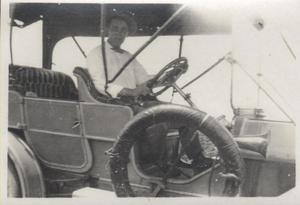 Primary view of object titled '[Photograph of a Man in a Car]'.