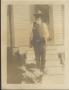 Photograph: [Man Standing on Steps]