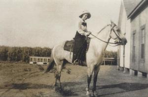 [Photograph of a Woman on a Horse]