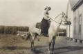 Primary view of [Photograph of a Woman on a Horse]