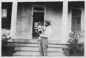 [George Dew and Lillie Dew on the Steps of the Dew House]